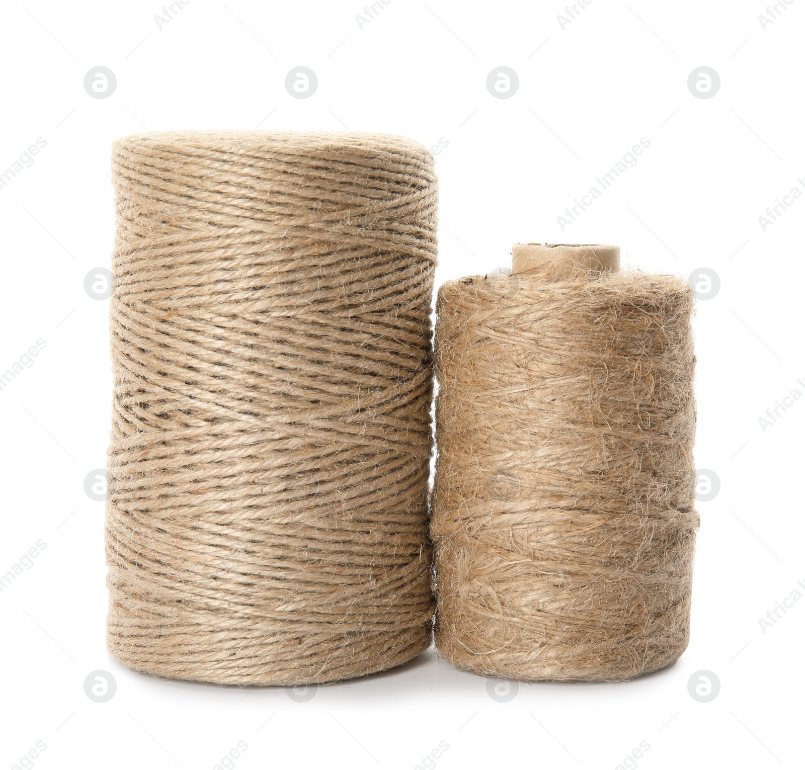 Photo of Spools of hemp rope on white background