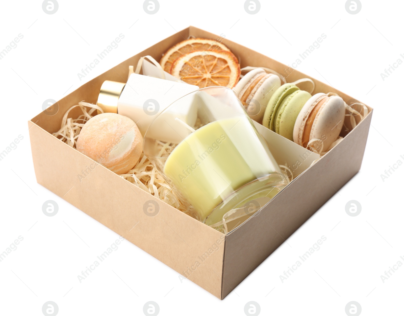 Photo of Gift set with candle and macarons in box on white background. Stylish present