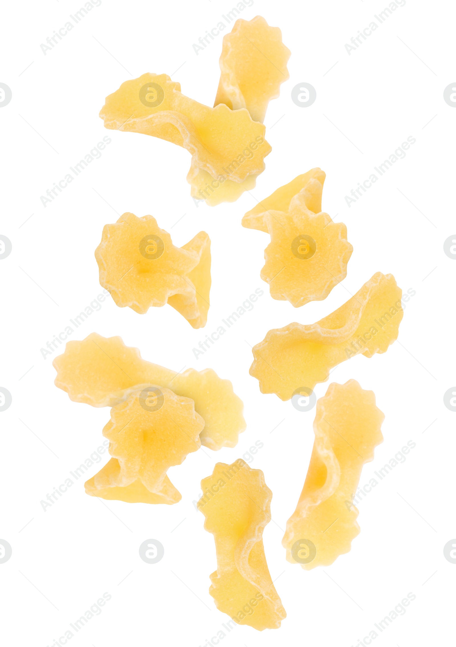 Image of Raw farfalline pasta falling on white background