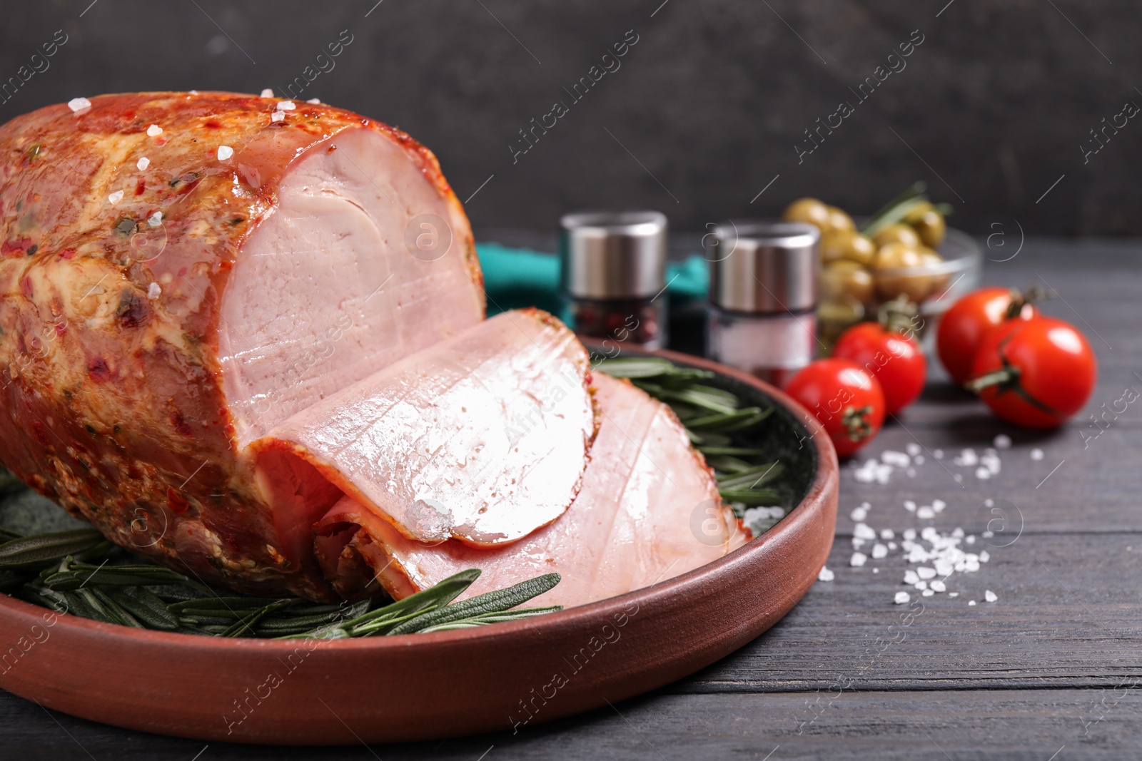 Photo of Delicious cooked ham served on wooden table