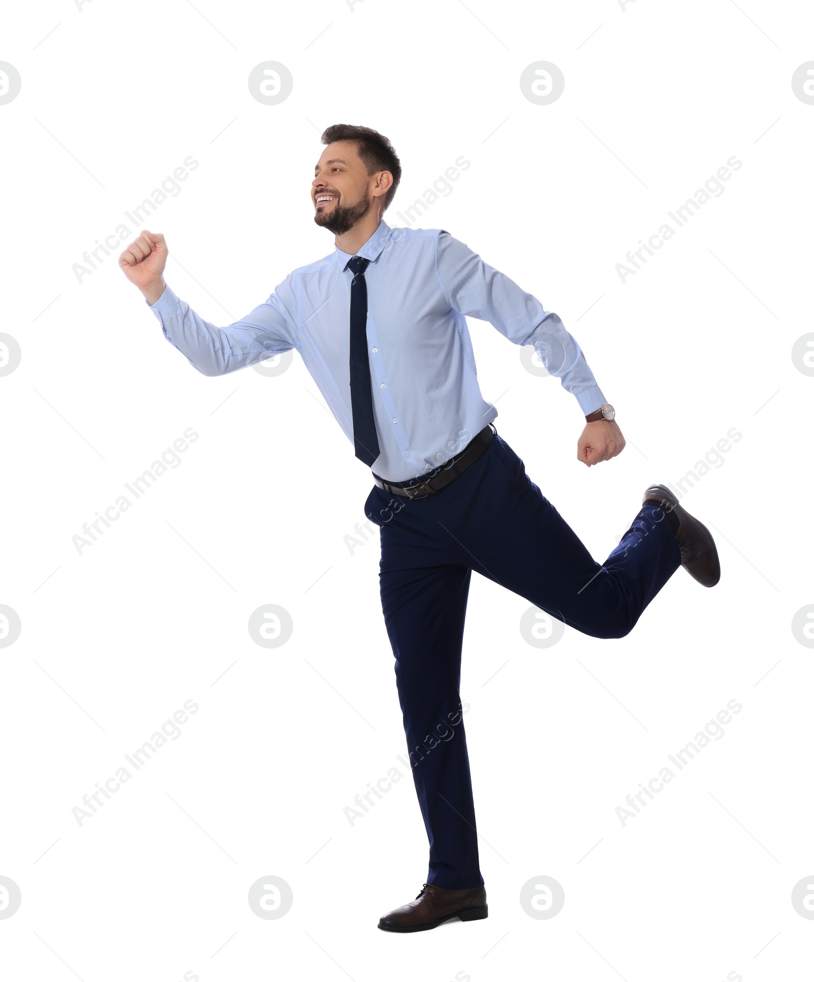 Photo of Handsome bearded businessman running on white background