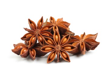 Photo of Dry anise stars with seeds on white background