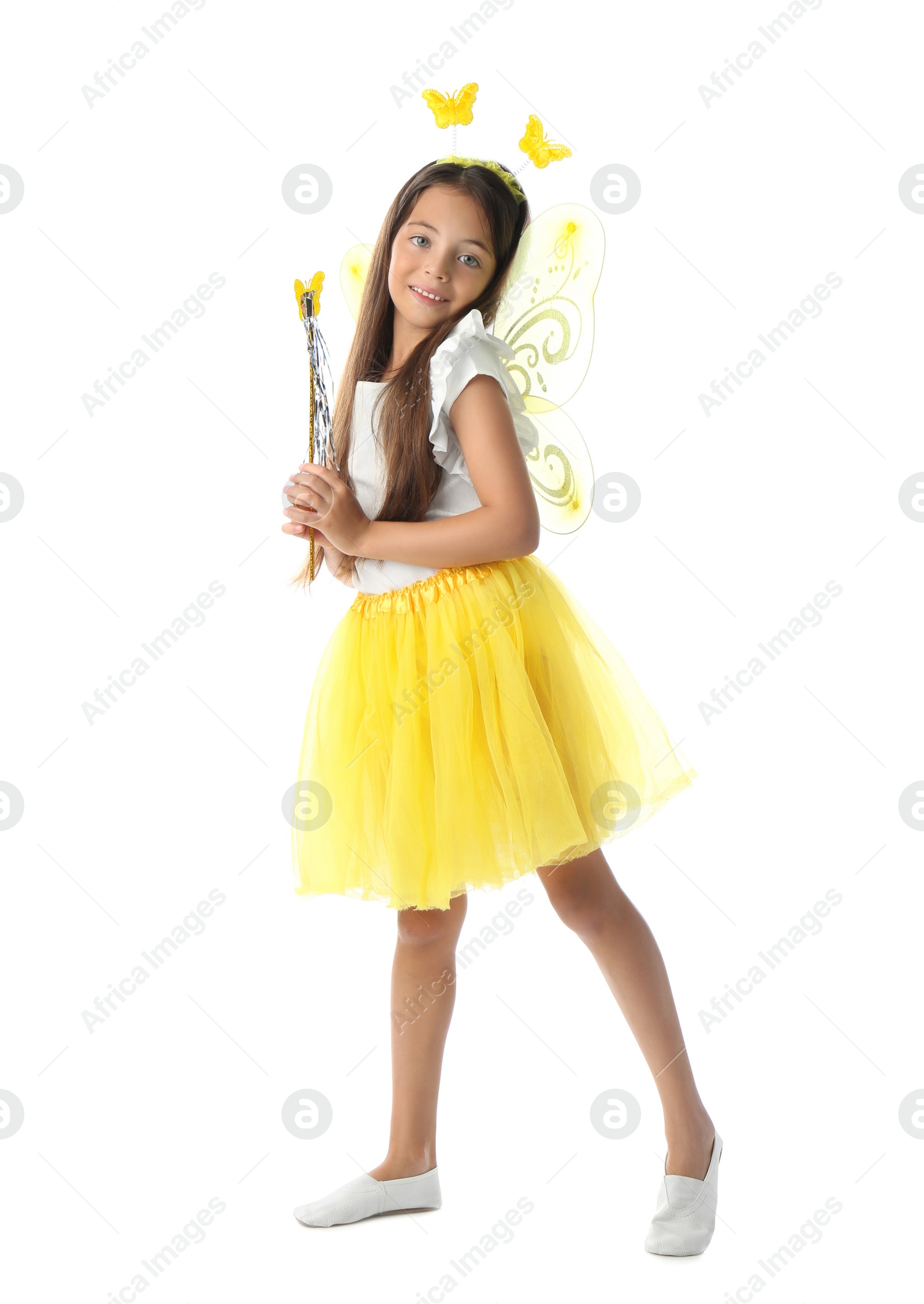 Photo of Cute little girl in fairy costume with yellow wings and magic wand on white background