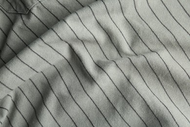 Photo of Texture of grey striped fabric as background, closeup