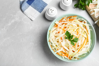 Photo of Flat lay composition with cabbage salad on light grey marble table