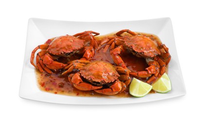 Photo of Delicious boiled crabs with sauce and lime isolated on white
