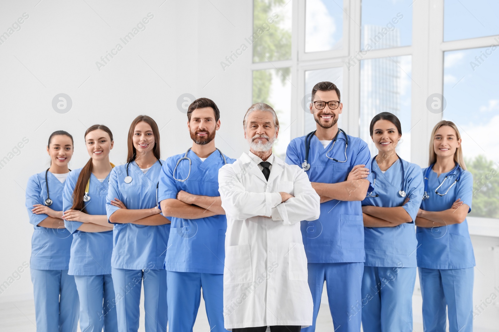 Photo of Doctor and his colleagues in hospital. Medical service