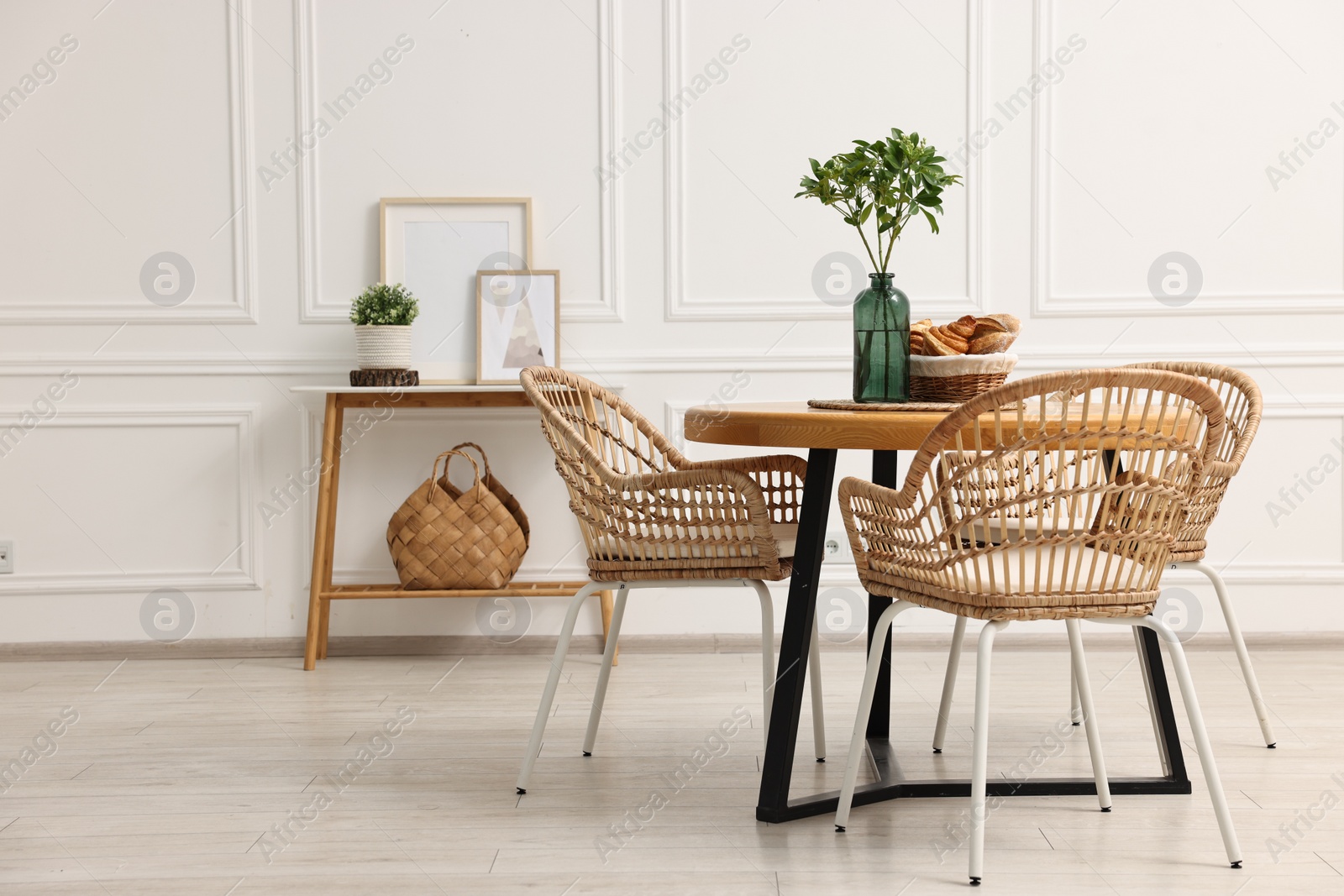 Photo of Dining room interior with comfortable furniture and plants