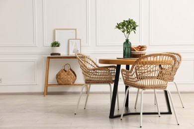 Photo of Dining room interior with comfortable furniture and plants