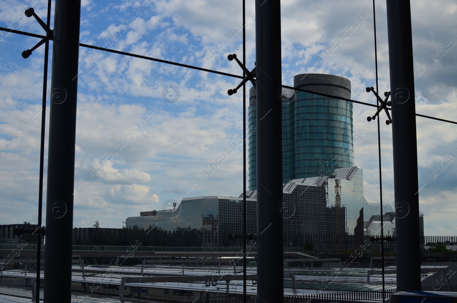 Photo of Beautiful view of buildings from big glass windows indoors