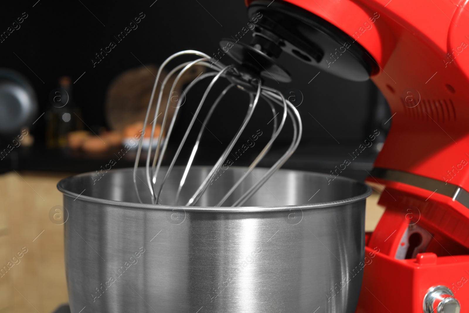 Photo of Modern stand mixer in kitchen, closeup. Home appliance