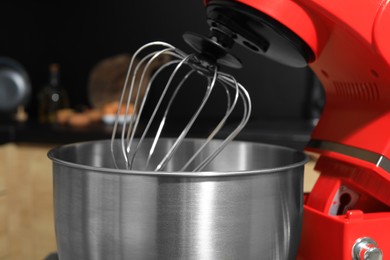 Photo of Modern stand mixer in kitchen, closeup. Home appliance