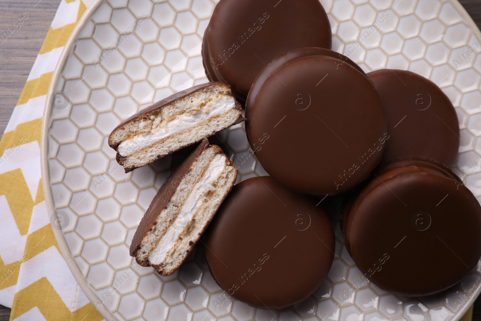 Photo of Tasty choco pies on plate, top view