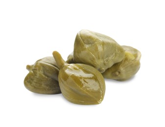 Many delicious pickled capers on white background