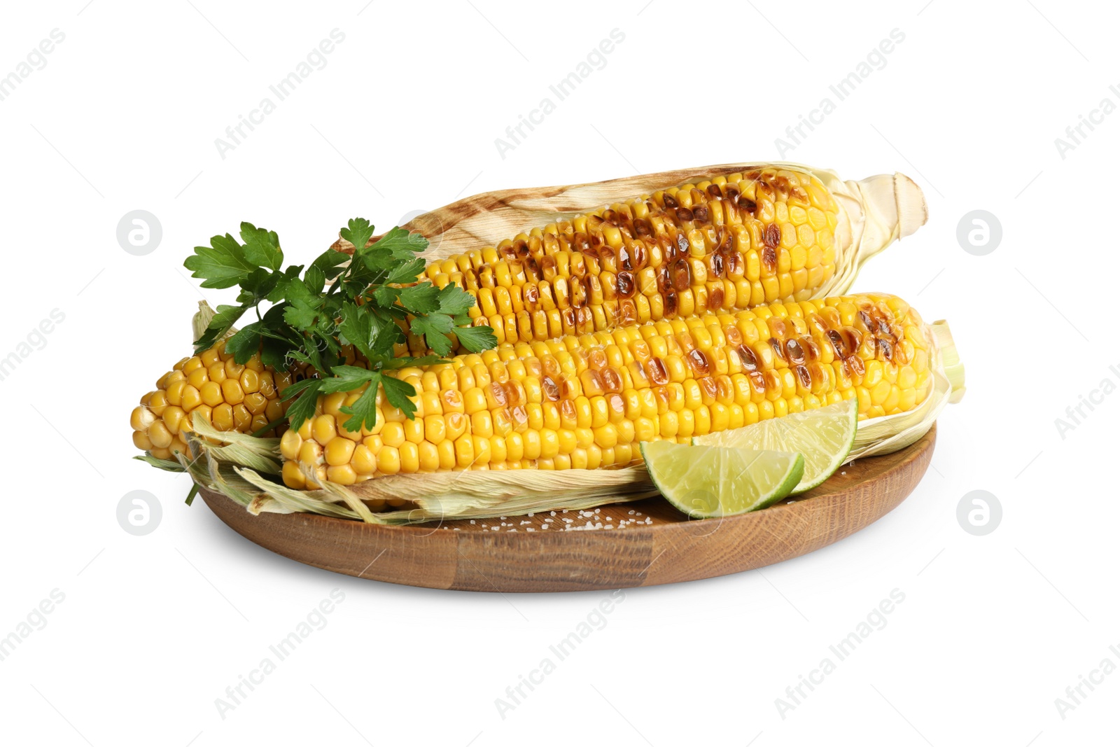 Photo of Delicious grilled corn cobs with parsley and lime on white background