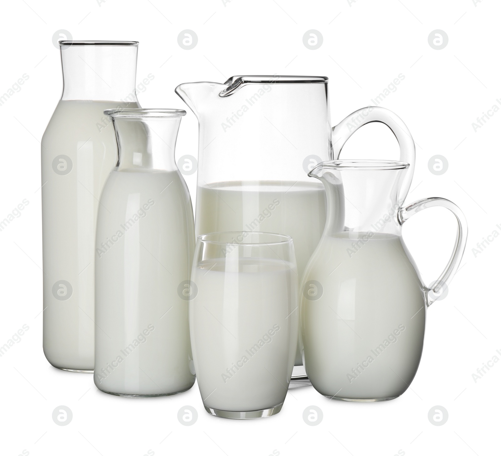 Photo of Glassware with fresh milk on black table against white background