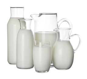 Photo of Glassware with fresh milk on black table against white background