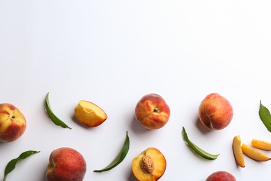 Photo of Composition with fresh peaches on white background, top view