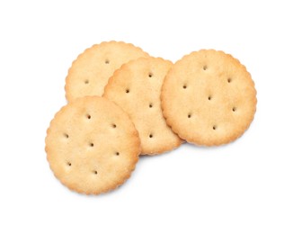 Tasty crispy round crackers isolated on white, top view