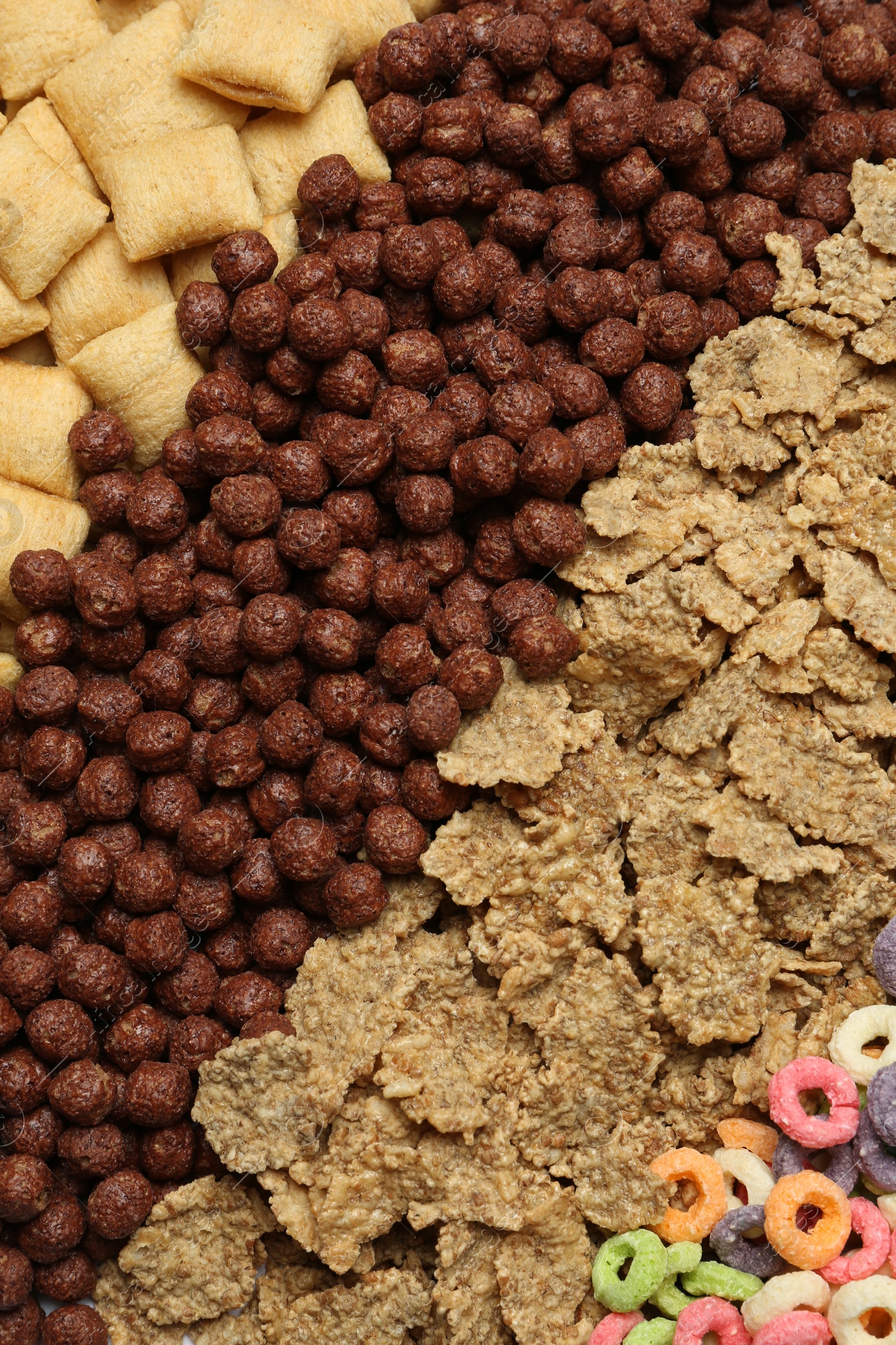 Photo of Different types of dry breakfast as background, top view