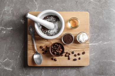 Photo of Ingredients for coffee scrub on wooden board