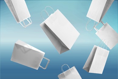Image of Hot sale. White shopping bags flying on light blue gradient background