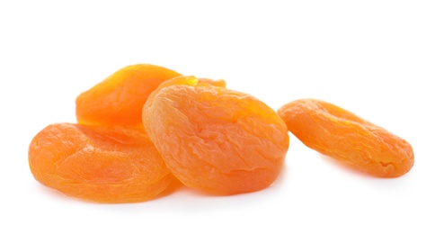 Photo of Tasty apricots on white background. Dried fruit as healthy food