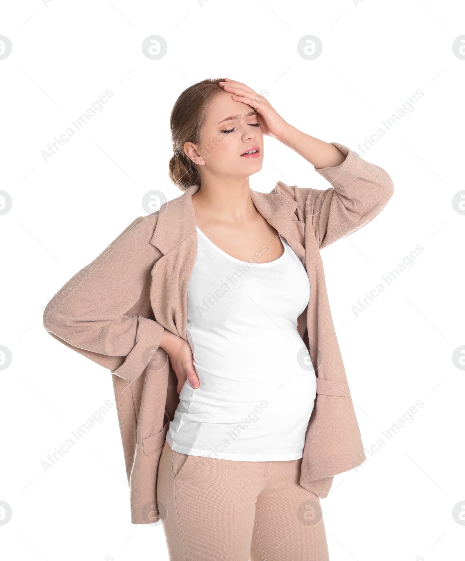 Photo of Young pregnant woman suffering from pain on white background. Working while expecting baby