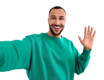 Photo of Smiling young man taking selfie on white background