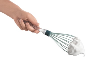 Photo of Woman holding whisk with whipped cream on white background, closeup