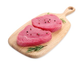 Fresh raw tuna fillets with peppercorns and rosemary on white background