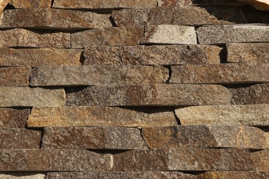 Photo of Texture of brown brick wall as background