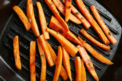 Closeup view of grill pan with sweet potato fries, top view