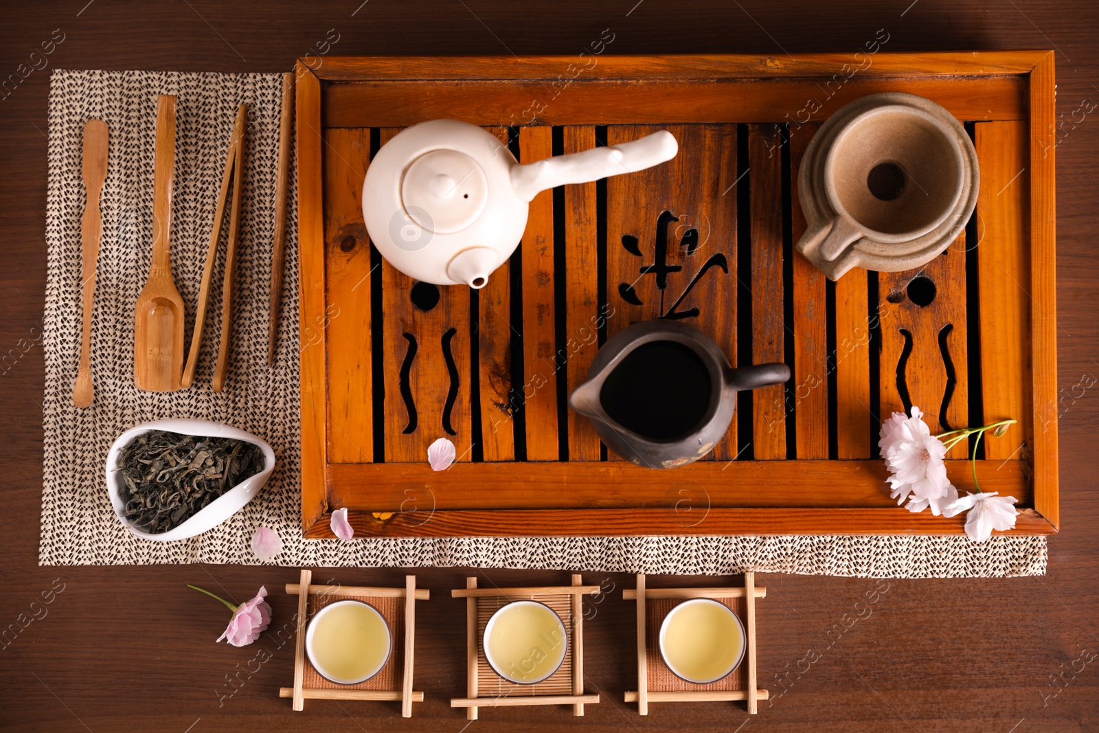 Photo of Beautiful set for traditional tea ceremony on wooden table, flat lay