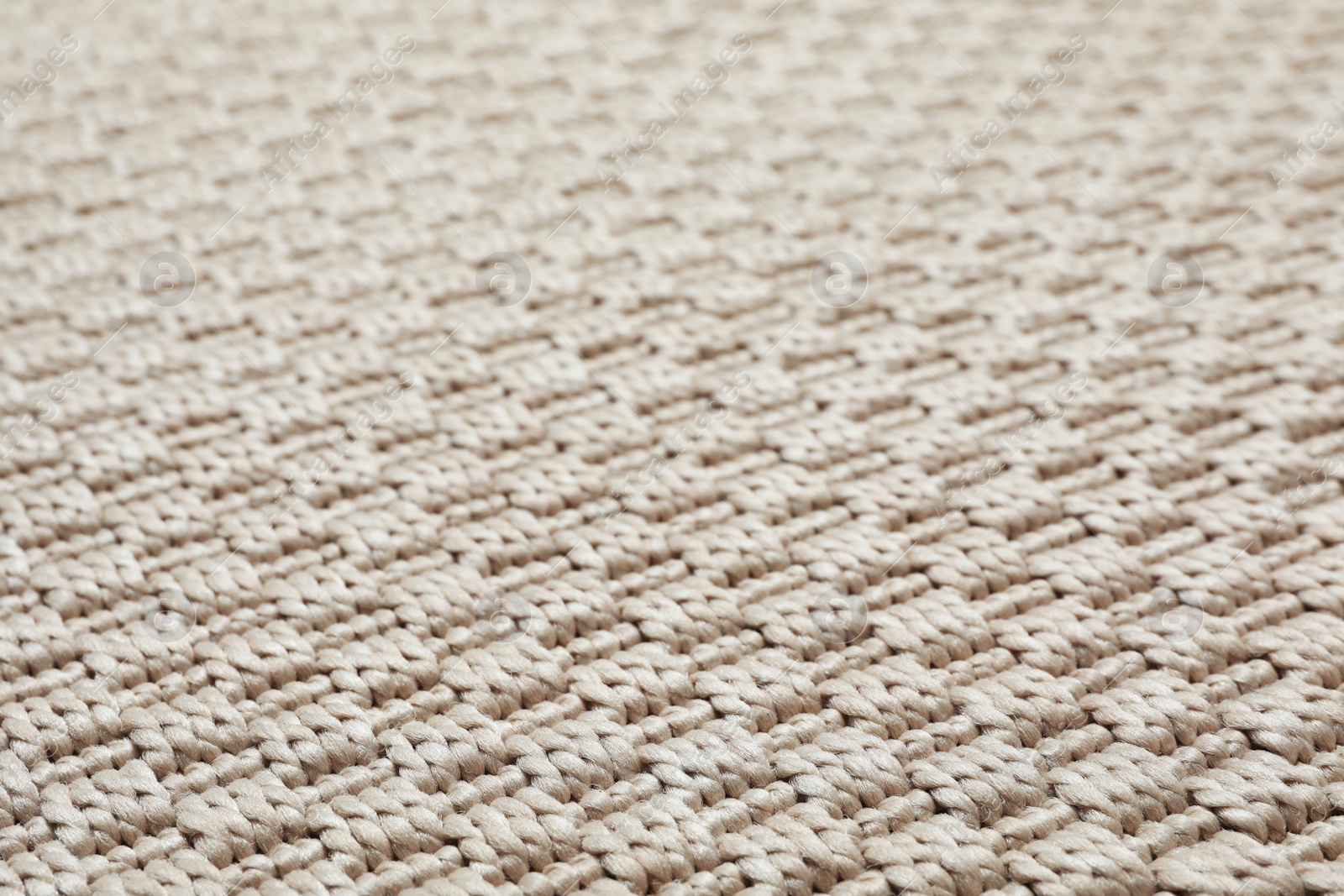 Photo of Beige woven carpet texture as background, closeup