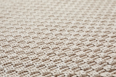 Photo of Beige woven carpet texture as background, closeup