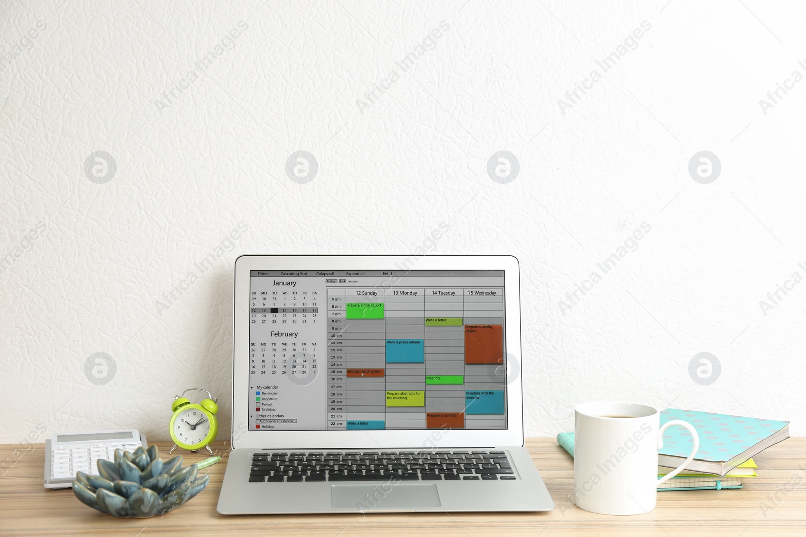 Photo of Modern laptop with calendar app in office