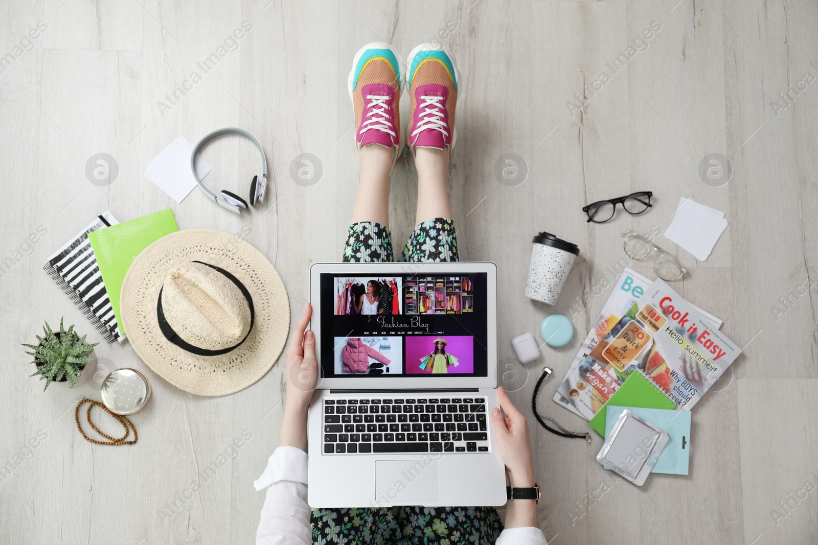 Photo of Fashion blogger with laptop on floor, top view