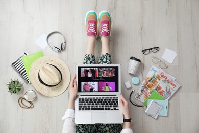 Fashion blogger with laptop on floor, top view
