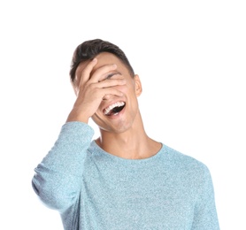 Photo of Portrait of handsome young man laughing on white background