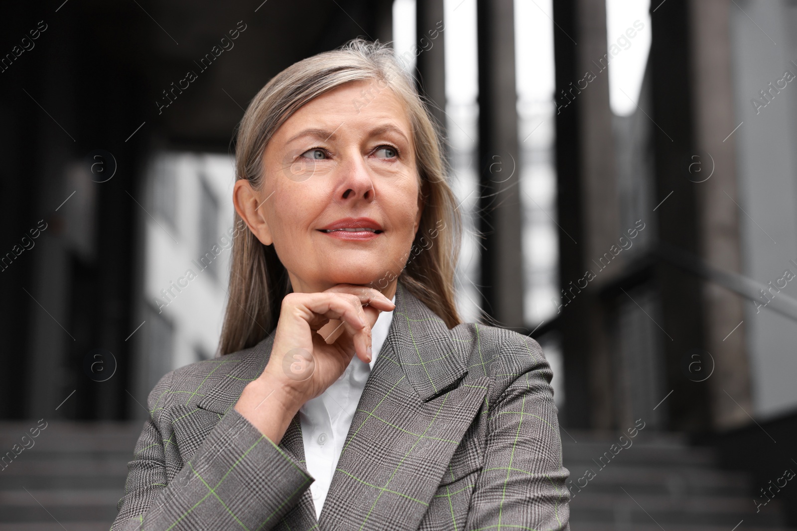 Photo of Portrait of beautiful woman outdoors. Lawyer, businesswoman, accountant or manager