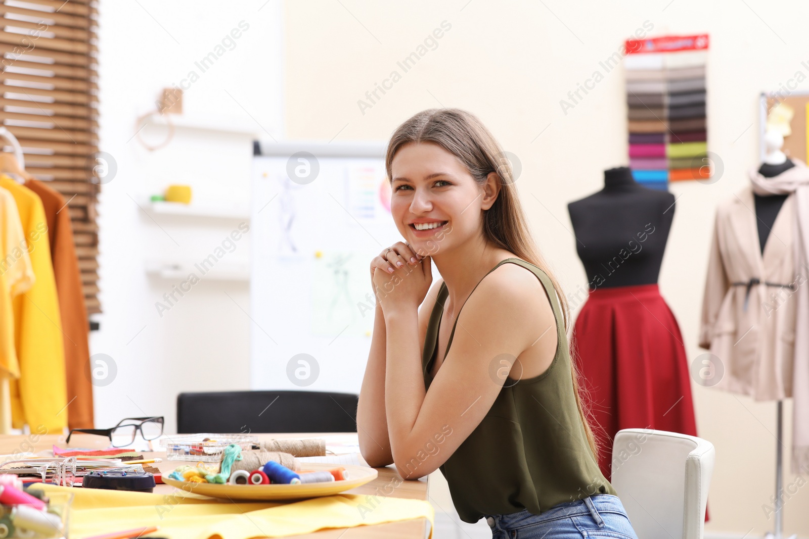 Photo of Fashion designer creating new clothes in studio