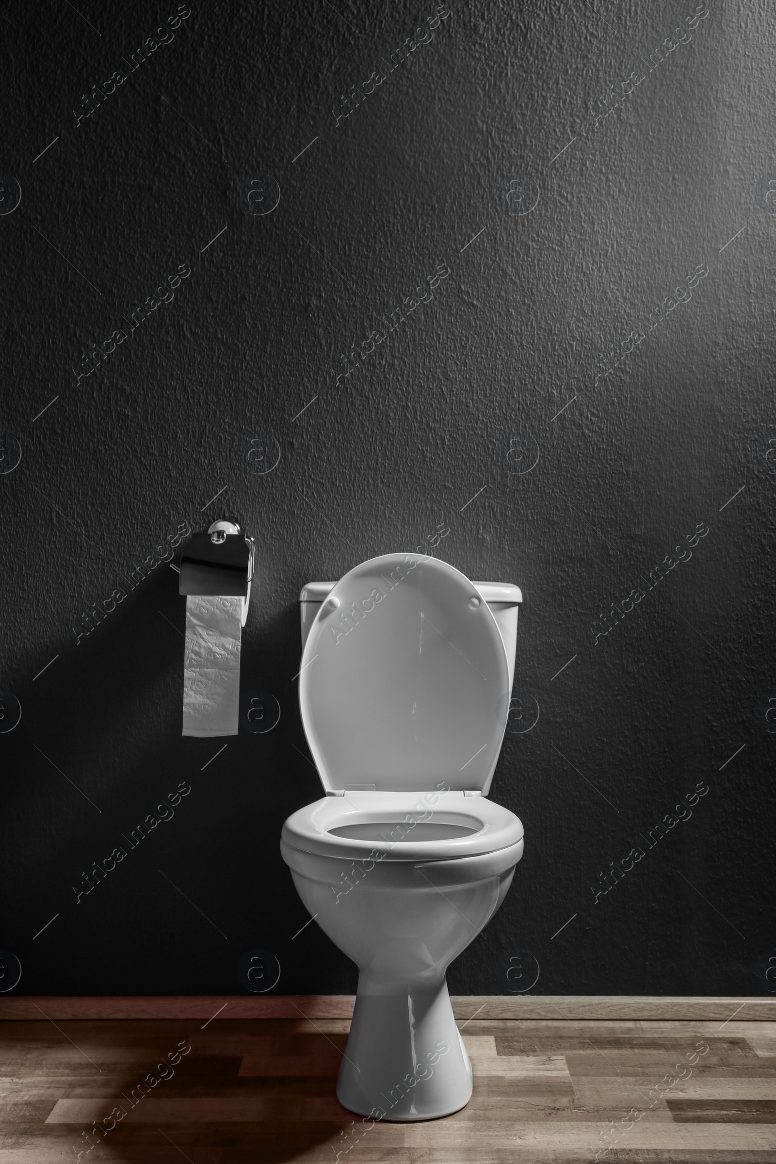 Photo of New ceramic toilet bowl in modern bathroom