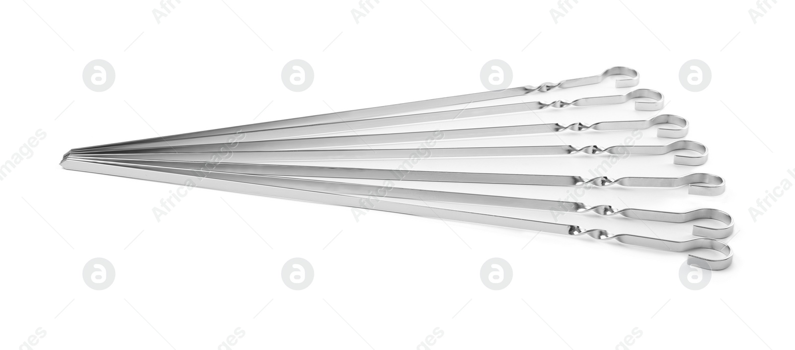 Photo of Metal skewers on white background. Barbecue utensil