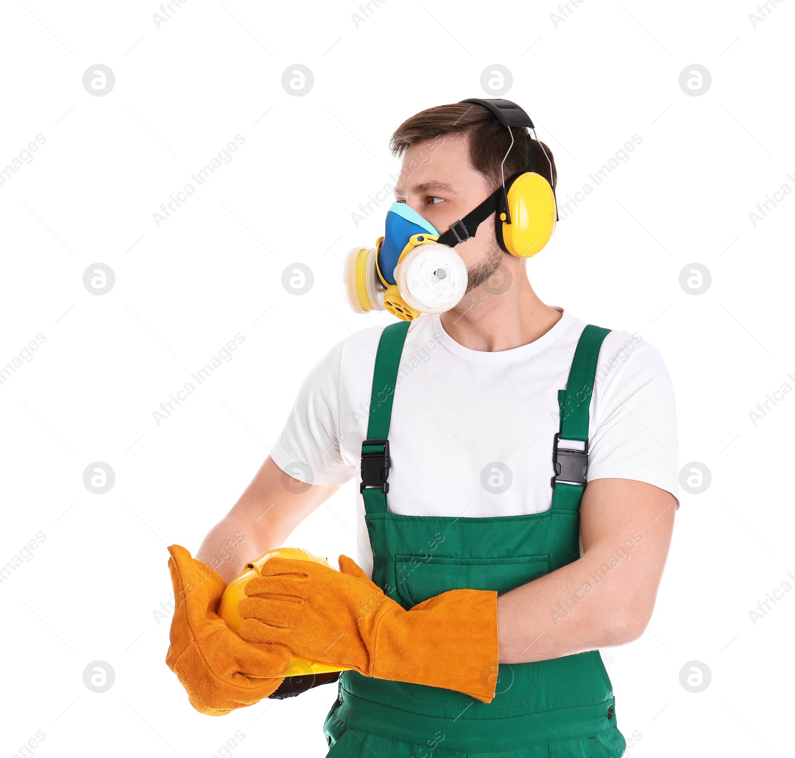 Photo of Male industrial worker in uniform on white background. Safety equipment