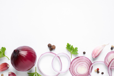 Flat lay composition with cut onion and spices on white background