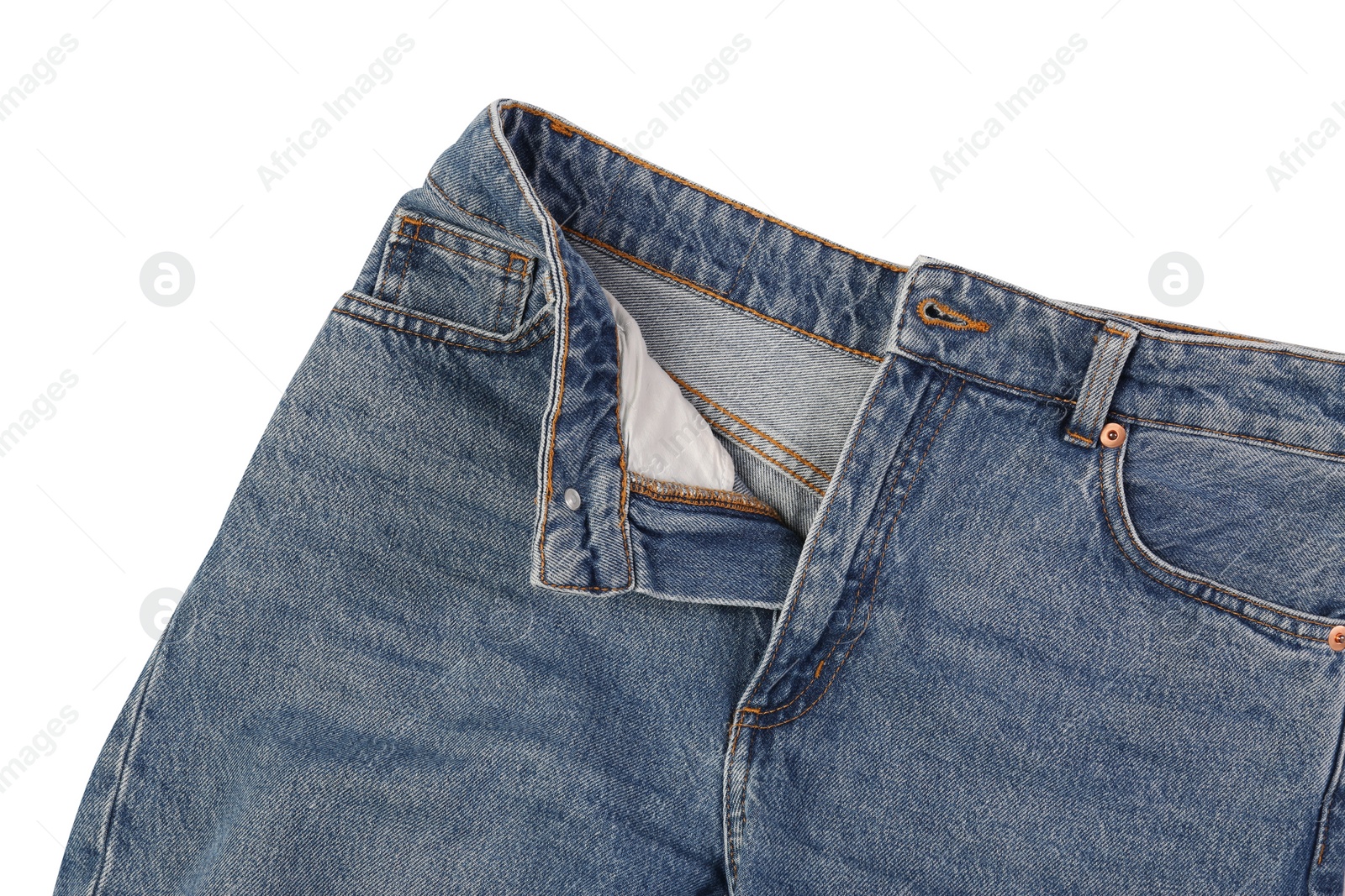 Photo of Stylish blue jeans isolated on white, top view