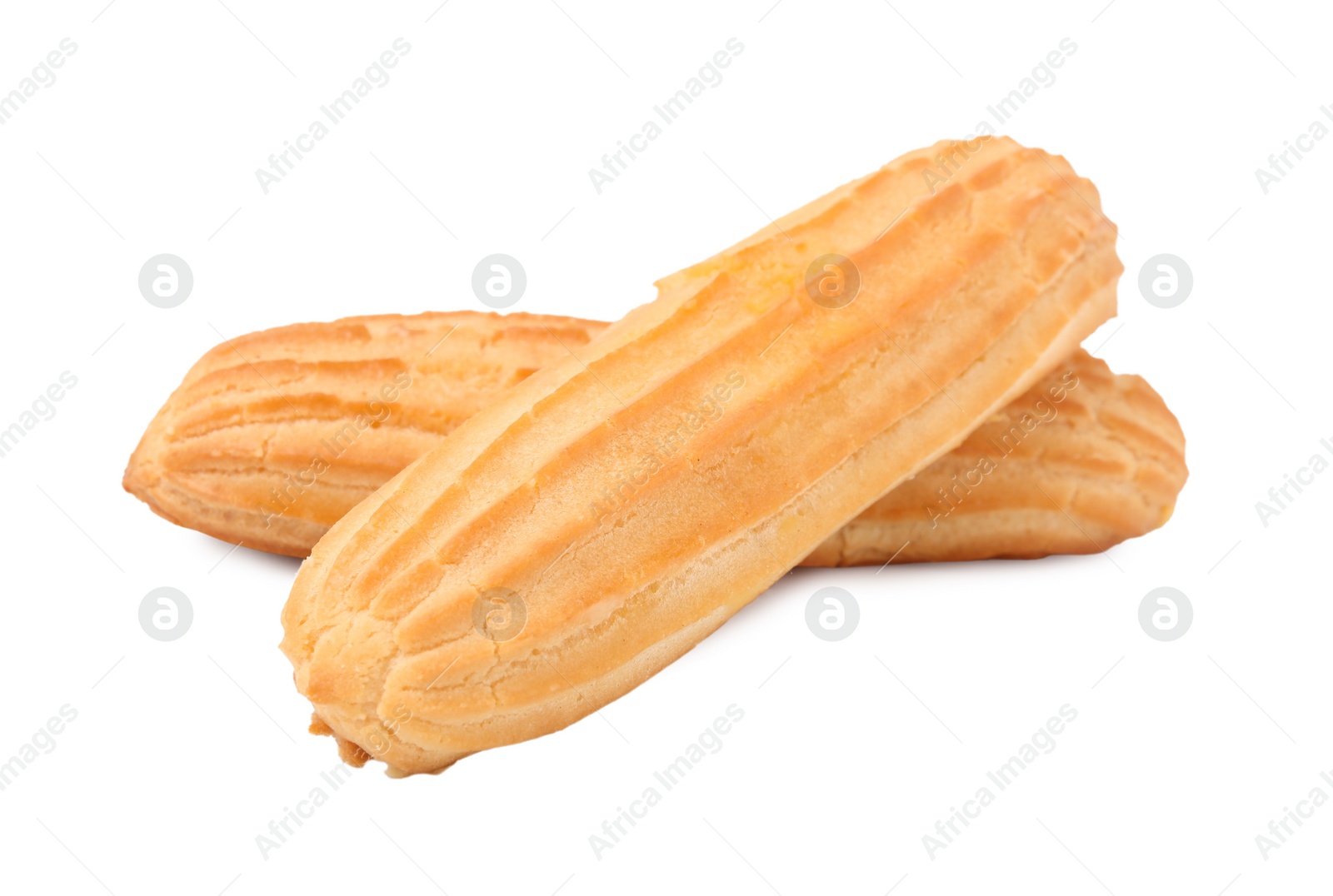 Photo of Two fresh delicious eclairs isolated on white