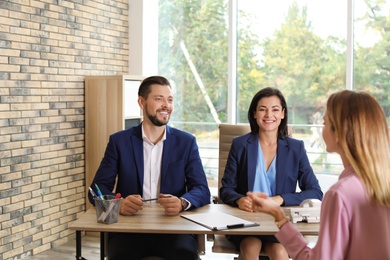 Human resources commission conducting job interview with applicant in office