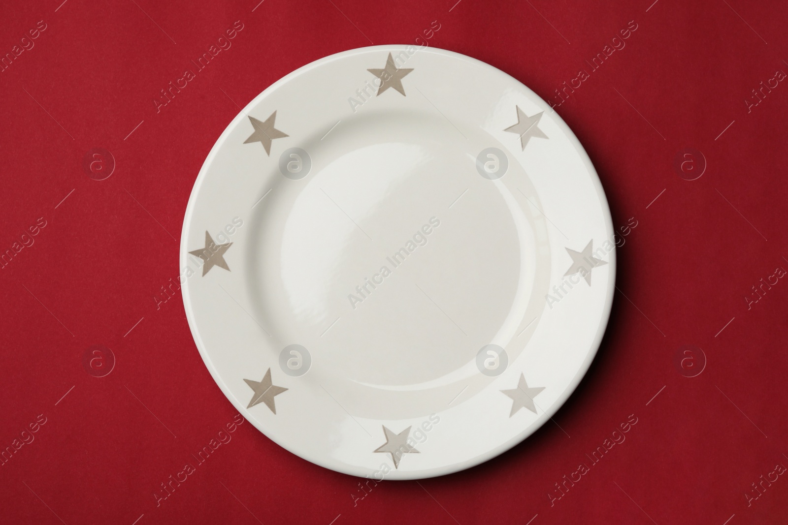 Photo of Clean empty plate on color background, top view